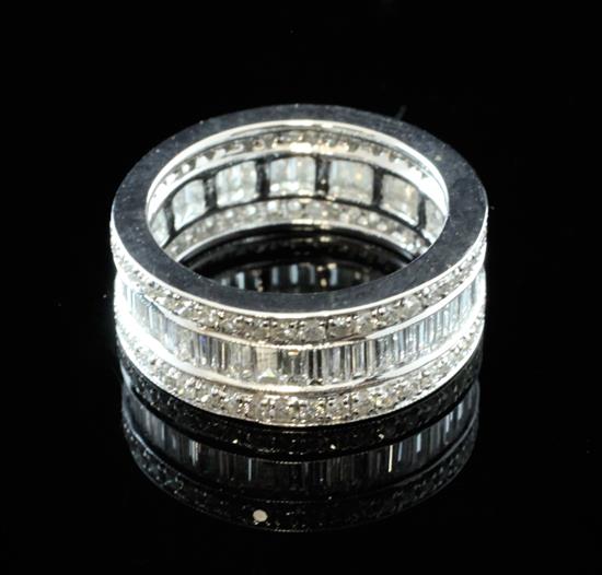 An 18ct white gold triple band diamond full eternity ring, size L.